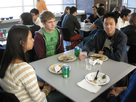 three students at table